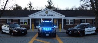 A group of police cars parked in front of a building

Description automatically generated with low confidence